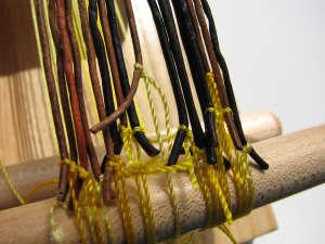 Warp ends individually tied to the front warp peg.